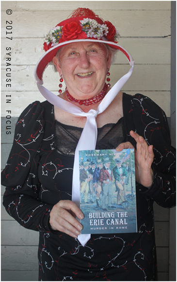 Author Rosemary Nichols braved 90 degree heat inside a building for the World Canals Conference publc event at the Syracuse Inner Harbor on Sunday.