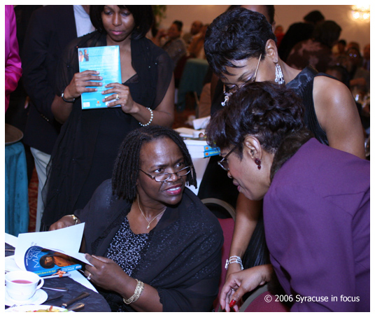(Oct. 29) Author Gloria Mallette (seated) signed books after she gave a reading for the Syracuse Chapter of the Go On Girl Book Club during their scholarship dinner on Saturday night. The event was held at the Wyndam Hotel.