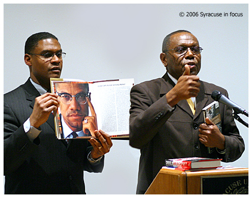 LIKE IT IS...(FEB. 22)--Lecturer Minister Akbar Muhammad (right) spoke yesterday at Syracuse University about the life of Malcolm X in the Nation of Islam. Yesterday marked the 41st anniversary of Malcolm's assassination. Muhammad is the International Representative for the Nation of Islam and is currently working on the autobiography of Minister Louis Farrakhan. Muhammad has been a Farrakhan aide for 40 years. Joining him is Syracuse's Minister Mark Muhammad (left).
